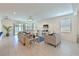 Spacious living room features tile flooring, comfortable seating, and sliding glass doors at 3419 74Th Avenue E Cir, Sarasota, FL 34243