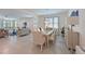 Open concept living and dining area with tile floors and ample natural light at 3419 74Th Avenue E Cir, Sarasota, FL 34243