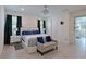 Comfortable main bedroom with a decorative chandelier and an ensuite bathroom featuring a glass enclosed shower at 3419 74Th Avenue E Cir, Sarasota, FL 34243