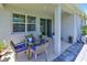 Covered patio is perfect for relaxation with outdoor furniture and views of the yard at 3419 74Th Avenue E Cir, Sarasota, FL 34243