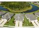 Aerial view of home highlighting expansive lot, paired driveways, and proximity to a serene pond at 4609 Deep Creek Ter, Parrish, FL 34219