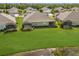 Aerial view of a home with a large backyard and screened-in patio overlooking a lake at 4609 Deep Creek Ter, Parrish, FL 34219