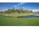 Expansive backyard with a serene lake view, perfect for outdoor enjoyment at 4609 Deep Creek Ter, Parrish, FL 34219