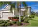 Charming single-Gathering home boasts lush landscaping and a well-manicured lawn, complemented by a two-car garage at 4609 Deep Creek Ter, Parrish, FL 34219