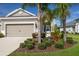 Beautiful home with manicured landscaping, featuring a two-car garage and inviting front entrance at 4609 Deep Creek Ter, Parrish, FL 34219