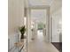 Welcoming hallway featuring tile floors, decorative accents, and an open view into the living spaces at 4609 Deep Creek Ter, Parrish, FL 34219