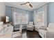 Bright office space with hardwood floors, white furniture, and natural light from two large windows at 4609 Deep Creek Ter, Parrish, FL 34219