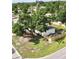 Aerial shot of home showcasing mature trees and a new fence around the property at 6031 11Th E St, Bradenton, FL 34203