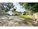 A spacious backyard with a new fence, lush green grass and exterior of home at 6031 11Th E St, Bradenton, FL 34203