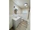 Renovated bathroom featuring a new vanity, decorative mirror, and tiled shower/tub at 6031 11Th E St, Bradenton, FL 34203