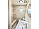 A modern bathroom featuring a tiled shower, a new vanity, and a window that provides natural light at 6031 11Th E St, Bradenton, FL 34203
