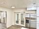 Bright kitchen featuring stainless steel appliances, shaker cabinets, and wood-look floors at 6031 11Th E St, Bradenton, FL 34203