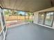 Enjoy the outdoors while remaining comfortable in this screened porch that leads to the backyard at 6031 11Th E St, Bradenton, FL 34203