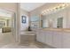 A luxurious bathroom boasts double sinks, a garden tub, and separate entry to the bedroom at 6644 Butlers Crest Dr, Bradenton, FL 34203