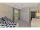Bright bedroom features a ceiling fan, closet, and window, offering a cozy and inviting space at 6644 Butlers Crest Dr, Bradenton, FL 34203