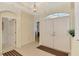 Bright entryway with tile flooring, high ceilings, and double doors leading to the main living area at 6644 Butlers Crest Dr, Bradenton, FL 34203