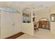 Spacious foyer with neutral colors, tray ceiling, leading to a dining area and living spaces at 6644 Butlers Crest Dr, Bradenton, FL 34203