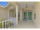 Inviting front porch with columns and railing, leading to a double door entryway at 6644 Butlers Crest Dr, Bradenton, FL 34203