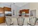 Well-lit kitchen featuring stainless steel appliances and breakfast bar at 6644 Butlers Crest Dr, Bradenton, FL 34203