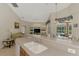 Kitchen featuring long breakfast bar with living room and lanai views at 6644 Butlers Crest Dr, Bradenton, FL 34203