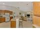 Bright and spacious kitchen and living room area with tile floors and ceiling fans at 6644 Butlers Crest Dr, Bradenton, FL 34203
