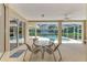 Covered patio area complete with dining table and view of the screened-in pool at 6644 Butlers Crest Dr, Bradenton, FL 34203