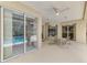 Covered patio area complete with dining table and view of the screened-in pool at 6644 Butlers Crest Dr, Bradenton, FL 34203