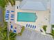 Birds-eye view of the pool area featuring lounging chairs, tables and an outdoor fire pit at 7611 34Th W Ave # 301, Bradenton, FL 34209