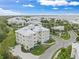 Aerial view of community showing the manicured grounds with water view at 7611 34Th W Ave # 301, Bradenton, FL 34209