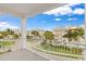 The balcony offers a view of the community and manicured green spaces at 7611 34Th W Ave # 301, Bradenton, FL 34209