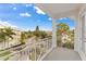 This balcony showcases a view of manicured landscaping and beautiful blue skies at 7611 34Th W Ave # 301, Bradenton, FL 34209