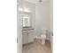 Small powder room featuring a vanity with granite countertop and toilet at 7611 34Th W Ave # 301, Bradenton, FL 34209
