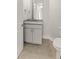 This bathroom features a granite counter and cabinet storage at 7611 34Th W Ave # 301, Bradenton, FL 34209