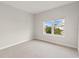 Clean, bright bedroom with lush green palm tree views from the window at 7611 34Th W Ave # 301, Bradenton, FL 34209