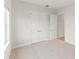 Bright bedroom featuring carpet, double door closets, and natural light at 7611 34Th W Ave # 301, Bradenton, FL 34209