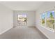Carpeted bedroom featuring balcony and window view at 7611 34Th W Ave # 301, Bradenton, FL 34209