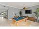 A community game room featuring a pool table, ceiling fan, television, and coastal themed decor at 7611 34Th W Ave # 301, Bradenton, FL 34209