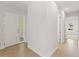 Bright hallway with tiled floors, white walls, and multiple doorways leading to other rooms at 7611 34Th W Ave # 301, Bradenton, FL 34209
