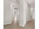Hallway with tiled floors, closet with bi-fold doors, and neutral-colored walls at 7611 34Th W Ave # 301, Bradenton, FL 34209