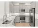 Well-equipped kitchen features stainless steel appliances and sleek gray cabinetry at 7611 34Th W Ave # 301, Bradenton, FL 34209