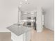 Modern kitchen featuring gray cabinets, stainless steel appliances, and granite countertops at 7611 34Th W Ave # 301, Bradenton, FL 34209