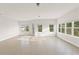 Open living room with tile floors and lots of natural light from several windows at 7611 34Th W Ave # 301, Bradenton, FL 34209