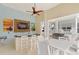 Pool bar with stainless steel grill, sink and seating area and mounted television at 7611 34Th W Ave # 301, Bradenton, FL 34209