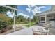 Backyard patio includes outdoor seating and has a grassy area and garden with plants, offering tranquility at 809 40Th St, Sarasota, FL 34234