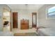 Charming bedroom with bright natural light and an adjacent sitting area with a comfortable rocking chair at 809 40Th St, Sarasota, FL 34234