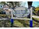 The community sign, 'Indian Beach Sapphire Shores Neighborhood,' welcomes residents and guests to this established neighborhood at 809 40Th St, Sarasota, FL 34234
