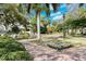 A courtyard with green lawns and shady benches at 809 40Th St, Sarasota, FL 34234