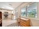 Kitchen with stainless appliances and a sunny view to the backyard at 809 40Th St, Sarasota, FL 34234