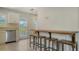 Bright kitchen with stainless steel appliances, bar top counter, and stools at 809 40Th St, Sarasota, FL 34234
