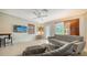 Cozy living room with contemporary furnishings, neutral tones, a ceiling fan, and a view to the outdoors at 809 40Th St, Sarasota, FL 34234